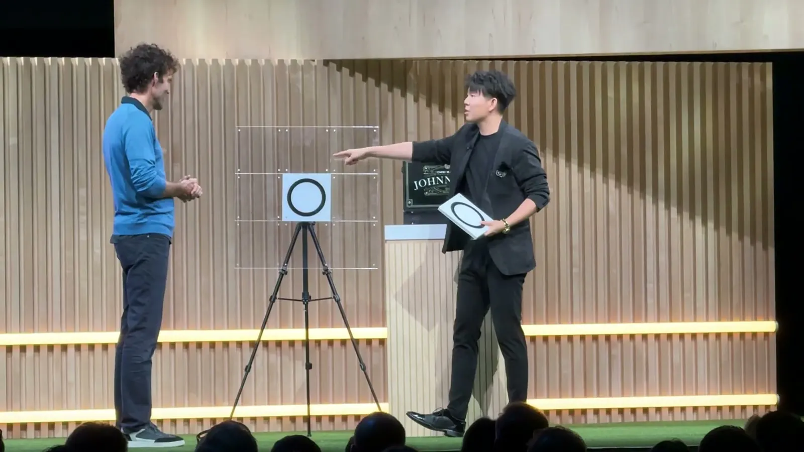 Johnny Wu on stage at Google HQ with Google's Chief Business Officer Philipp Schindler joining him as a volunteer